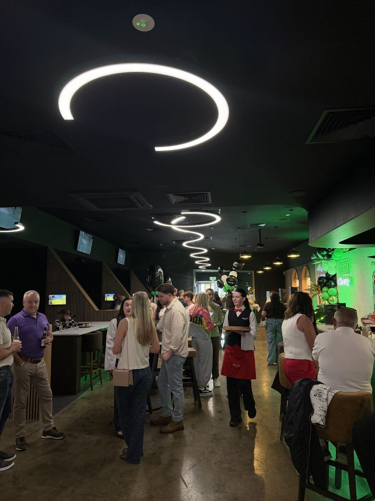 Guests mingling at the bar