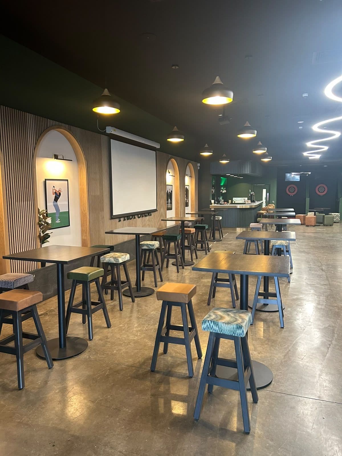 Function space with projector screen and tables